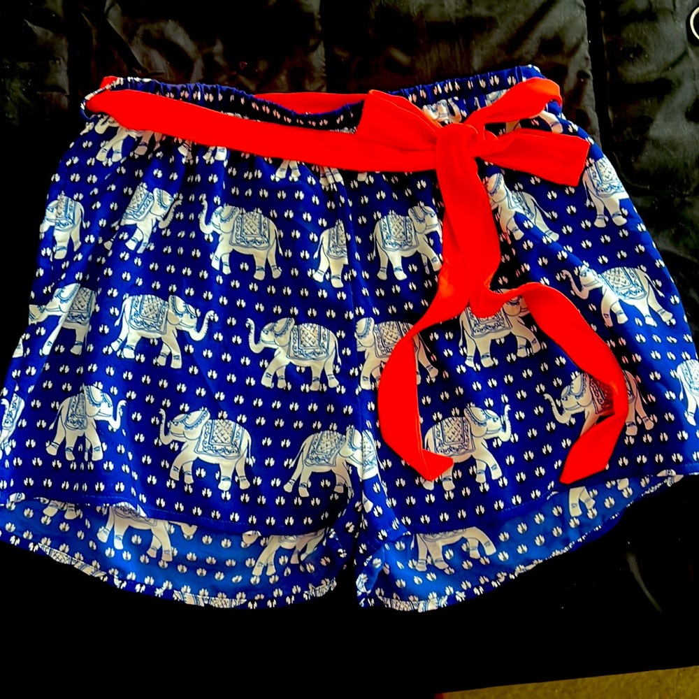 NWT royal blue, white silky shorts with orange belt. Size Small.